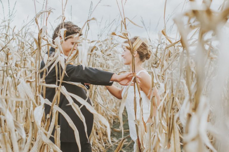 A couple's portrait of the newlyweds Erin and Jesse Birden in a farm field in Newtown, CT
